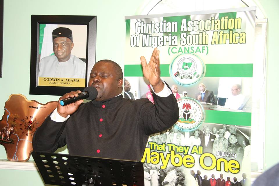 Rev Nicholas leading a prayer session